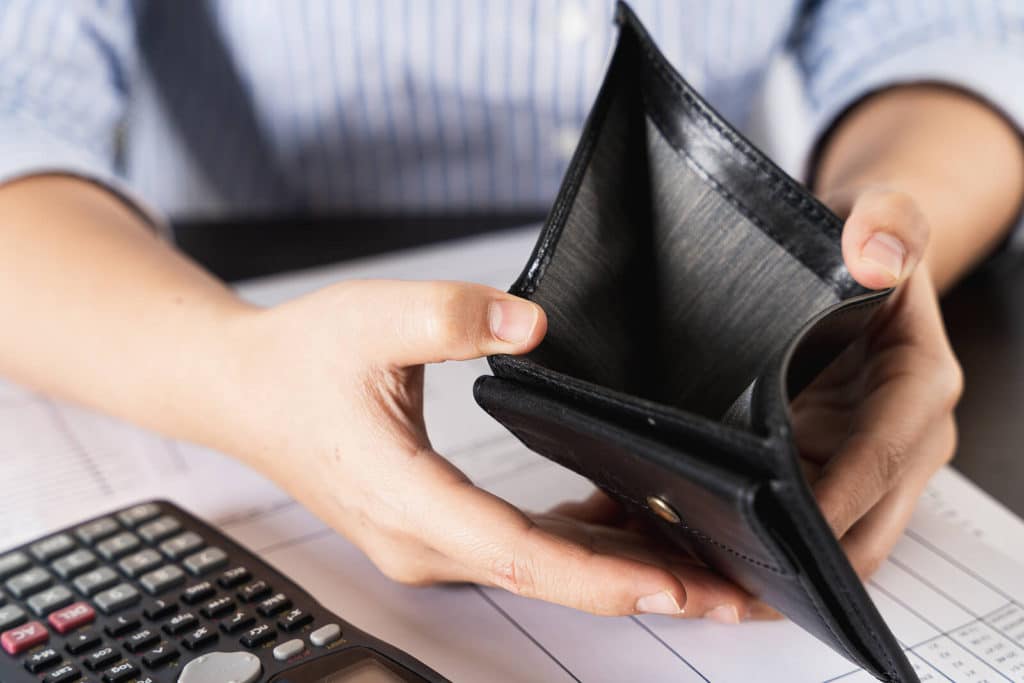 person holding an empty wallet